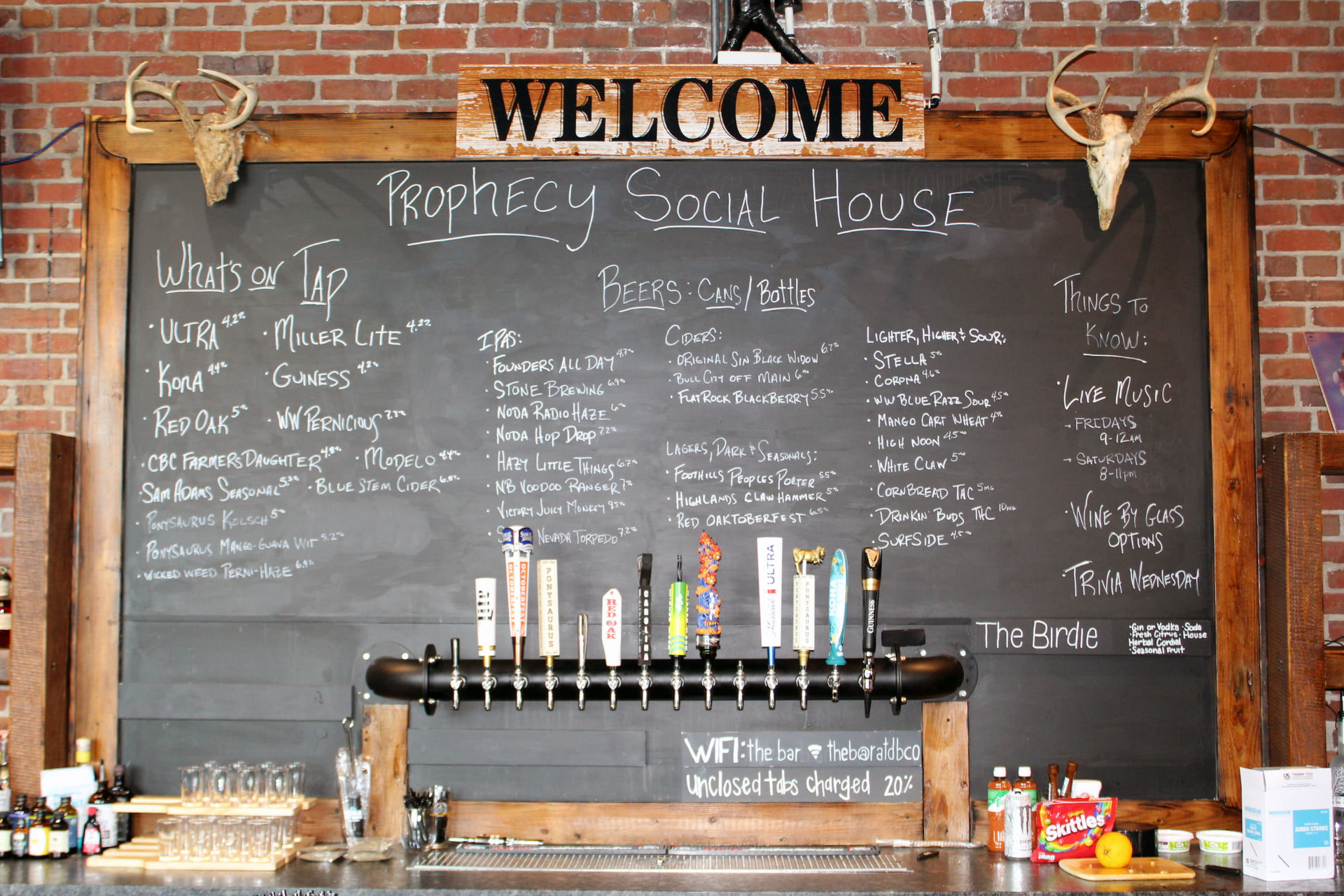 Welcome chalkboard menu at Prophecy Social House listing beers, cocktails and events